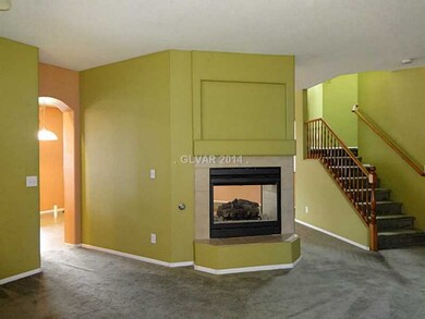Property Photo. 2 way gas fireplace between living