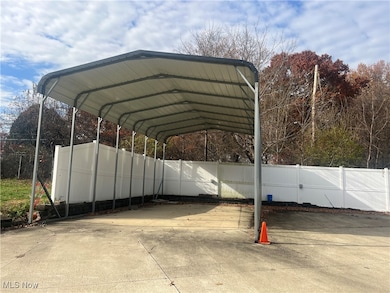 View of vehicle parking perfect for RV      storage complete with electricity.