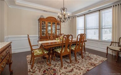 Dining Rm W/ Site Finished Hardwoods, Tray Ceiling & Crown/Chair Rail Molding.