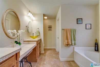 Hard tile floors in the master bath, double split 