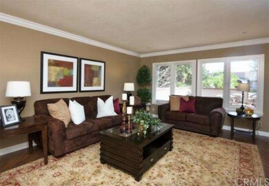 Large Living room has wide baseboards, crown moldi