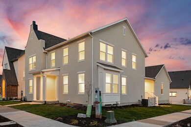 View of front of house with a front yard, stucco siding, a chimney, and a residential view