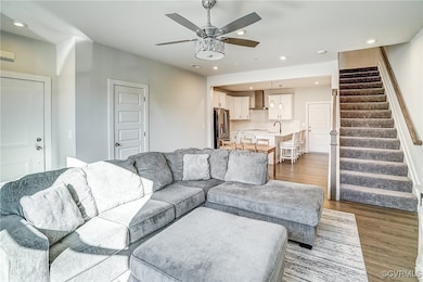 Living room featuring sink, wood-type flooring, an
