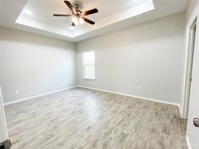 Primary bedroom with plenty of space and a connecting bathroom with all the amenities.