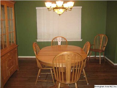 Nice size dining room with hardwood flooring.