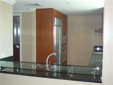 View into kitchen from dining/living area