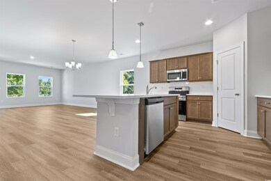Kitchen with decorative light fixtures, hardwood /