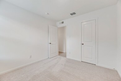 Unfurnished bedroom with carpet and baseboards