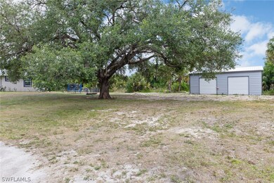 View of yard with a garage and an outdoor structur