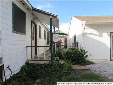 Back of house with walk through to pool