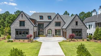 View of front of home with french doors, concrete 