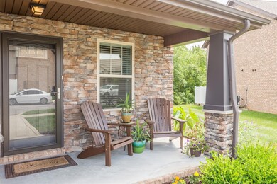 Covered front patio with custom layout that is open to the end of the home!