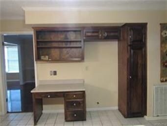 Desk area with storage located in the kitchen