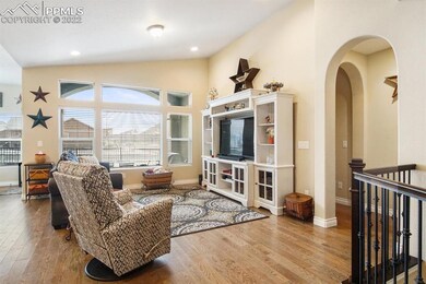 Living room with hardwood floors, beautiful archwa