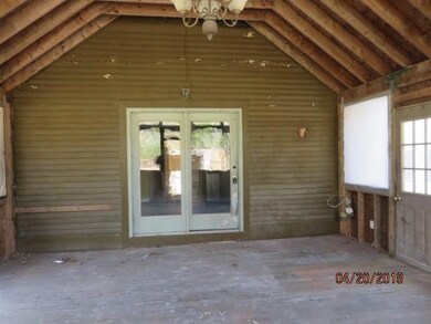The home features a large, screened...