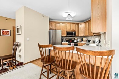 Kitchen with light hardwood / wood-style floors, a