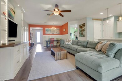 Living room featuring visible vents, wood finished