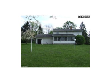 View of the back of the house, screened porch and 