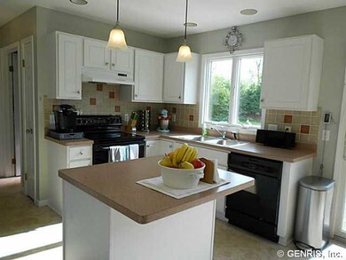Kitchen. The kitchen has a tiled back splash, whit
