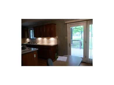 Kitchen with great lighting under cabinets. door t