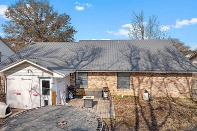 Rear view of property featuring a deck