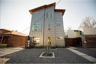 Rear view of property featuring a gate