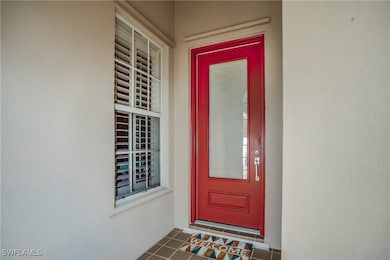 Entrance to property featuring stucco siding