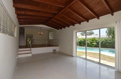 LIVING ROOM WITH WOOD VAULTED CEILING AND VIEW OF