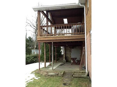 Exterior Back. Back view of wrap around porch.