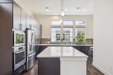  Stainless steel appliances, and a large island wi