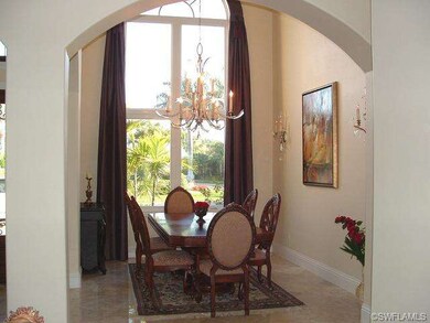 Formal Dining with soaring 20 ft ceiling and 12 ft
