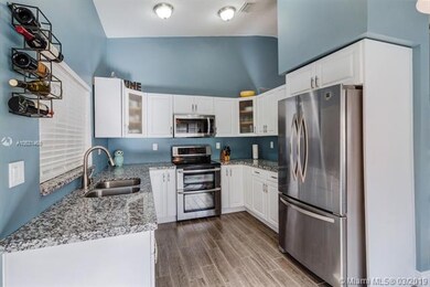 Kitchen features granite counter tops, updated sta