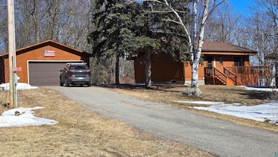 Exterior space featuring aphalt driveway