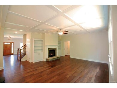 Family Room with detailed ceiling, built in bookca