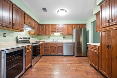 The kitchen includes stainless appliances includin