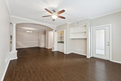 A view of the living room with built in bar and en