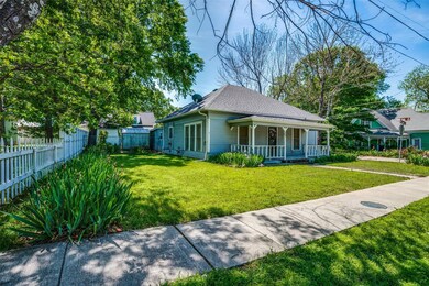 Bungalow-style home with a front lawn and a porch