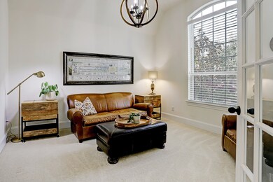 You will pass through the double French doors into the Study (currently being used as Formal Living room) to the right of the foyer entrance.  This room lets in lots of natural light if you  work from home.