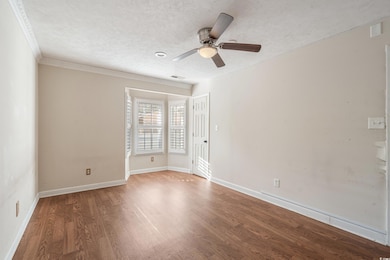 Empty room featuring visible vents, baseboards, ce