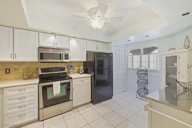 Kitchen featuring stainless steel appliances, back