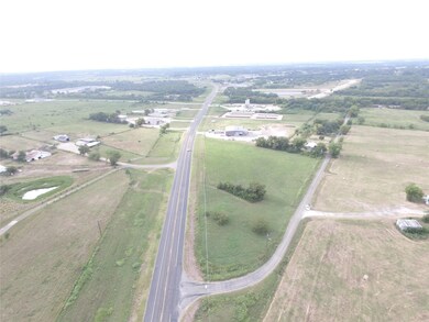 Birds eye view of property featuring a rural view
