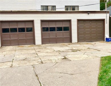 Garage bay on right goes with upper apartment. Has