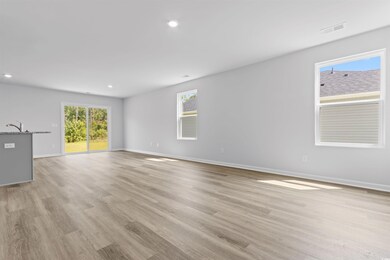 Empty room with sink and light wood-type flooring