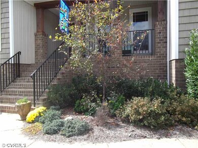 Exterior Front - Brick steps lead to concrete fron