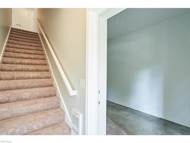 Walk into the front door and up a flight of steps 