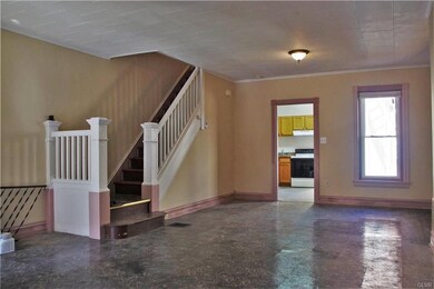 Beautiful stairway and room for a formal dining ar
