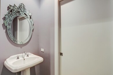 The Powder Room with decorative mirror.  The Laund
