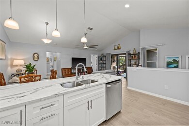 Kitchen featuring white cabinetry, light wood-type