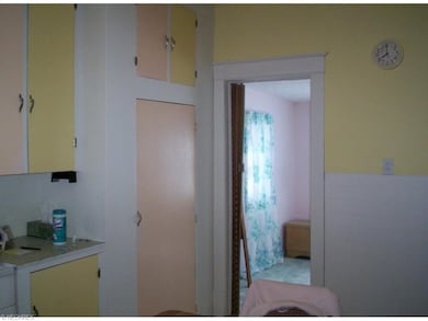 Kitchen has ample cabinetry and the master bedroom is off of it.