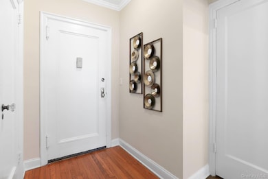 Entry Foyer has Two Closets: a double cedar & utility. Hardwood Flooring